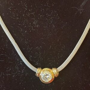 14k white gold chain 16” & 14k gold pendant with over a carat CZ.